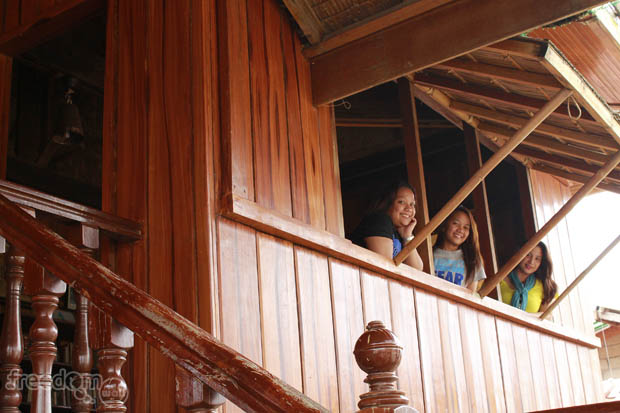 The ladies looking out of the window. Waiting for serenading suitors?