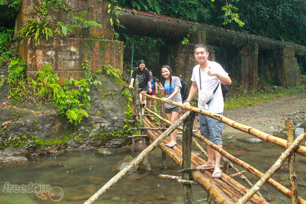 Crossing the makeshift bridge with Francis Velasco, Karen Salting, and Jo Anne Marpuri