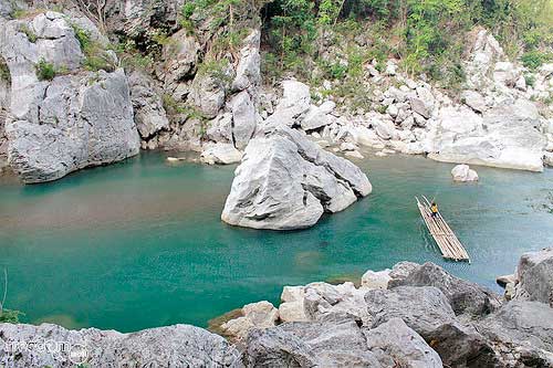 The kid used “balsa” or bamboo raft to cross the river