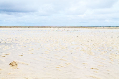 A vast shoreline appears at low tide in Cagbalete