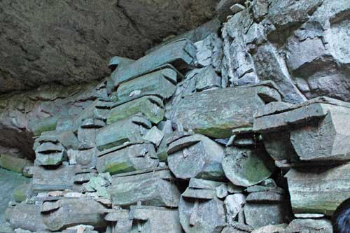 Stacked log coffins at Lumiang Cave