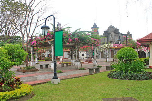 Nayong Pilipino garden with the replica of Barasoain Church in the background