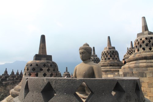 The highest tier of Candi Borobudur is adorned with 72 seating Buddha images housed in perforated stupas