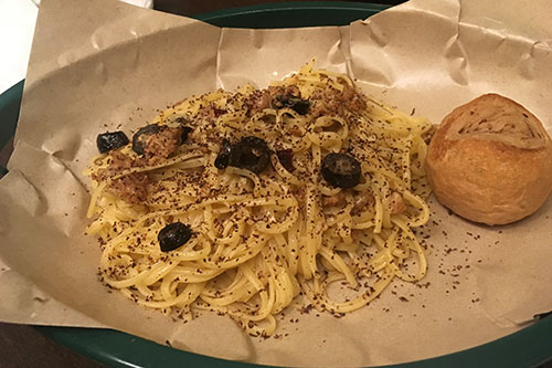 Spanish chorizo pasta sprinkled with grated cacao de bola