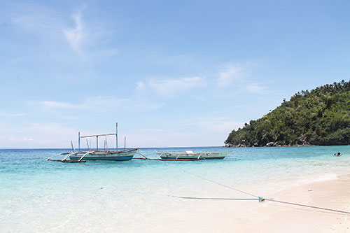 Fisher's boats floating off the coast of Hermit's Cove