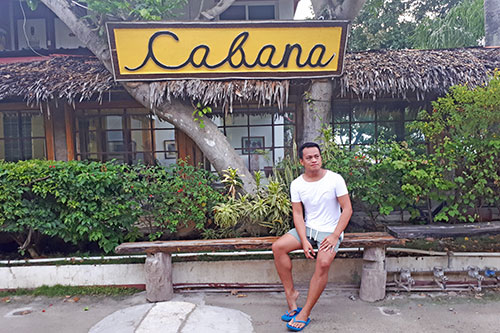 Ian Limpangog at the facade of Cabana Beach Club's reception