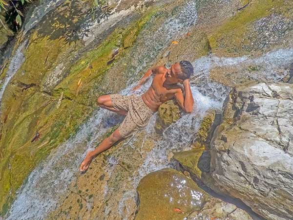 One of the fascinating cascades of Giligaon Falls. Bernardo Limpangog Jr at Giligaon Falls.