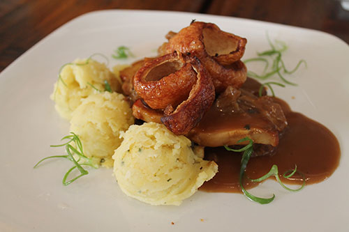 Crunchy slow roast pork belly with apple and fennel compote