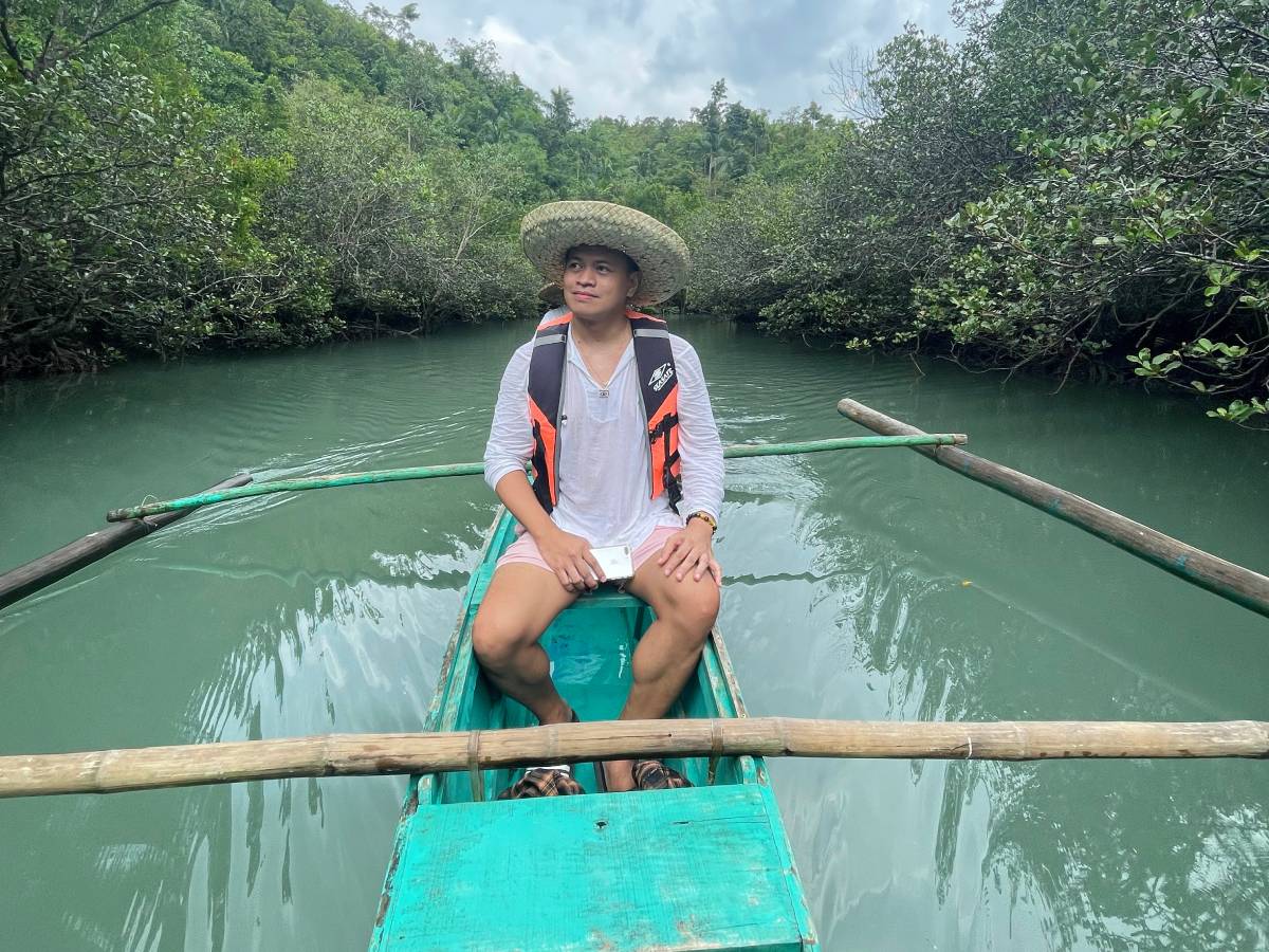 Cruising Bojo River using a paddle boat (baroto)