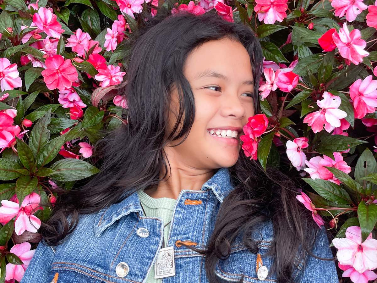 My niece, Angelica, with a bed of busy lizzie (impatiens) blooms