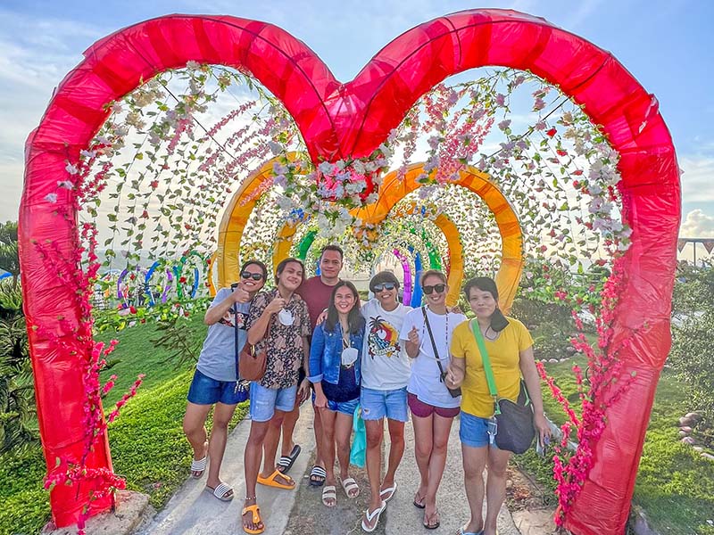 With friends at Cafe Alicia. The decorative installation is from the 2022 Valentine and Summer Fest season