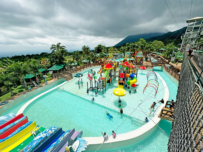 Campuestohan's waterpark, featuring water slides, wave pool, and sprinklers
