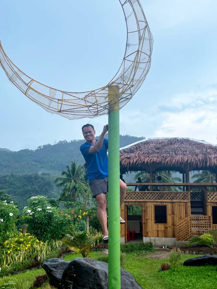 Scaling the quarter moon tower at Moon Garden
