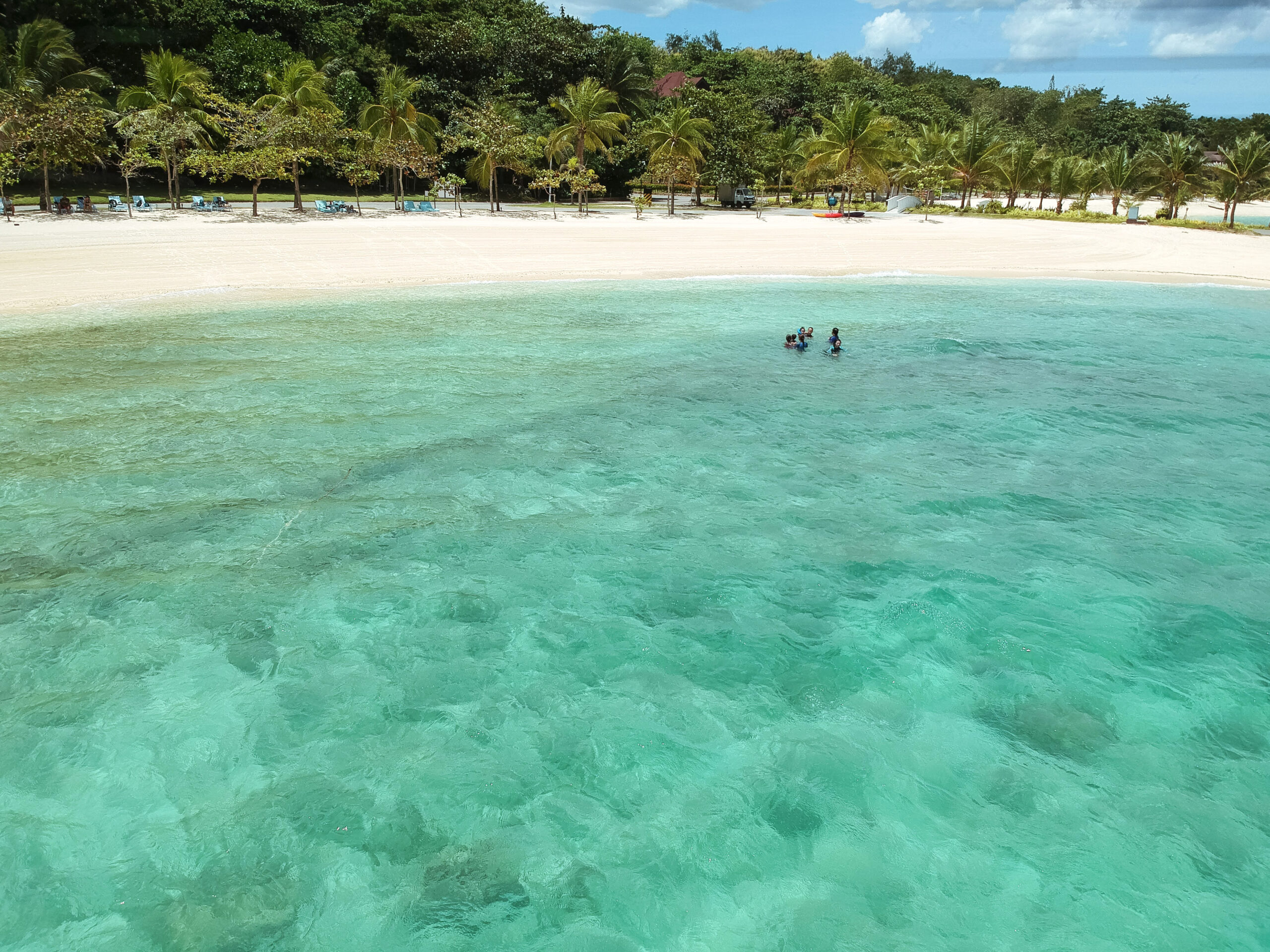 Captivating beachfront with a turquoise deep at the foreground  