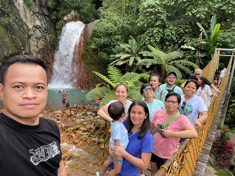 Groupie at the hanging bridge in Pulang Bato Falls resort