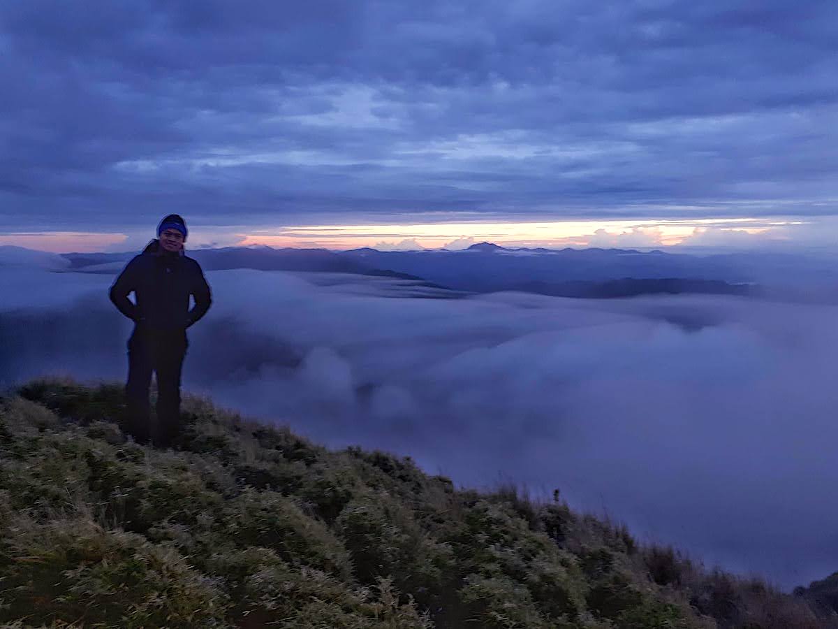 At the summit of Mount Pulag, enjoying the experience of the sea of clouds