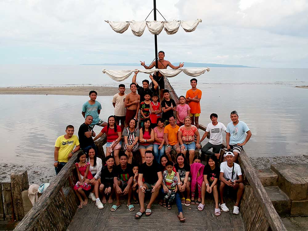 Group photo at Dumaguete Port Royale beach (Pirate ship)