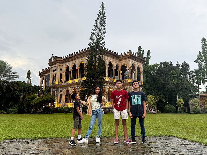 Kids enjoying the photo ops at The Ruins
