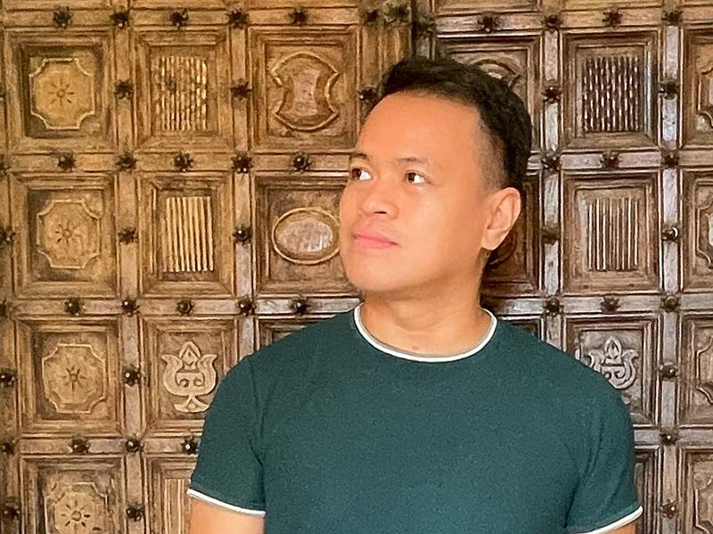 In the Backdrop is an intricately carved door patterns of Capilla Santa Ana
